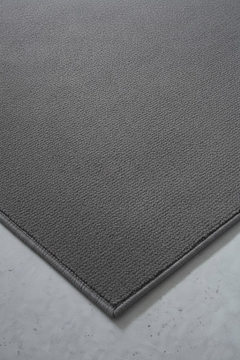 Charcoal Low-Pile Home Office Area Rug styled in a room