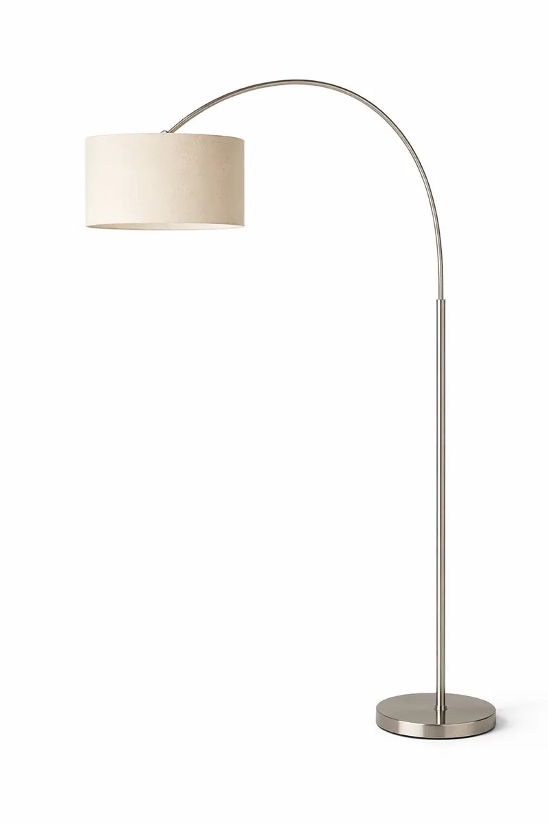 Budget arc floor lamp creating warm ambient light in a living room corner