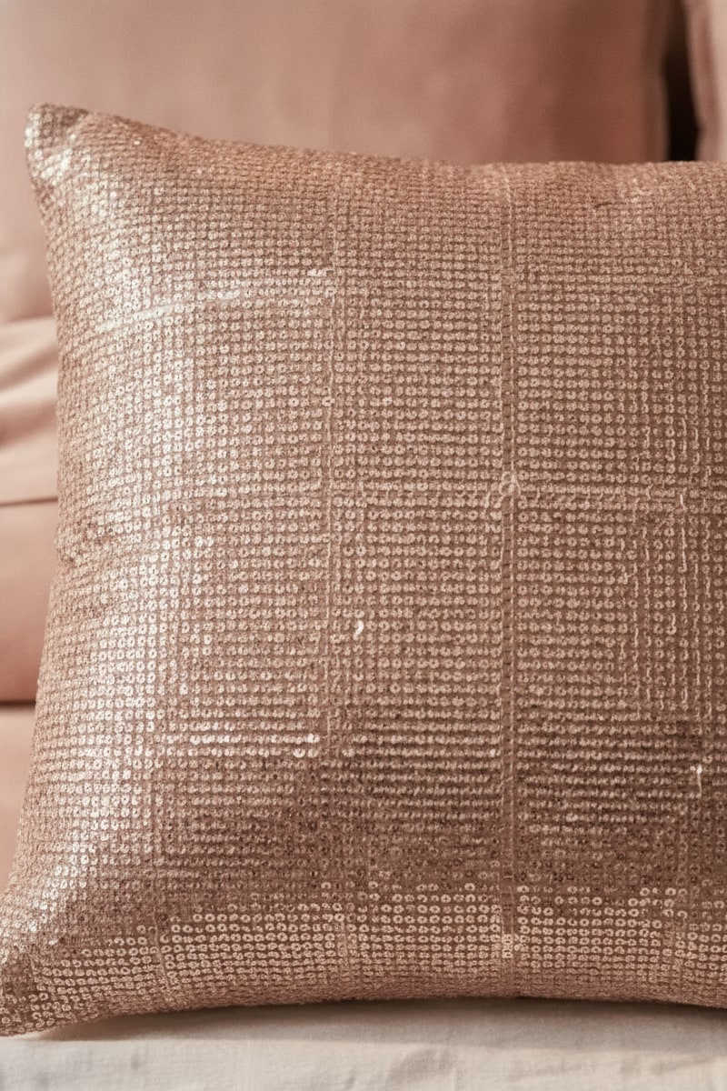Rose Gold Metallic Woven Lumbar Pillow styled in a room