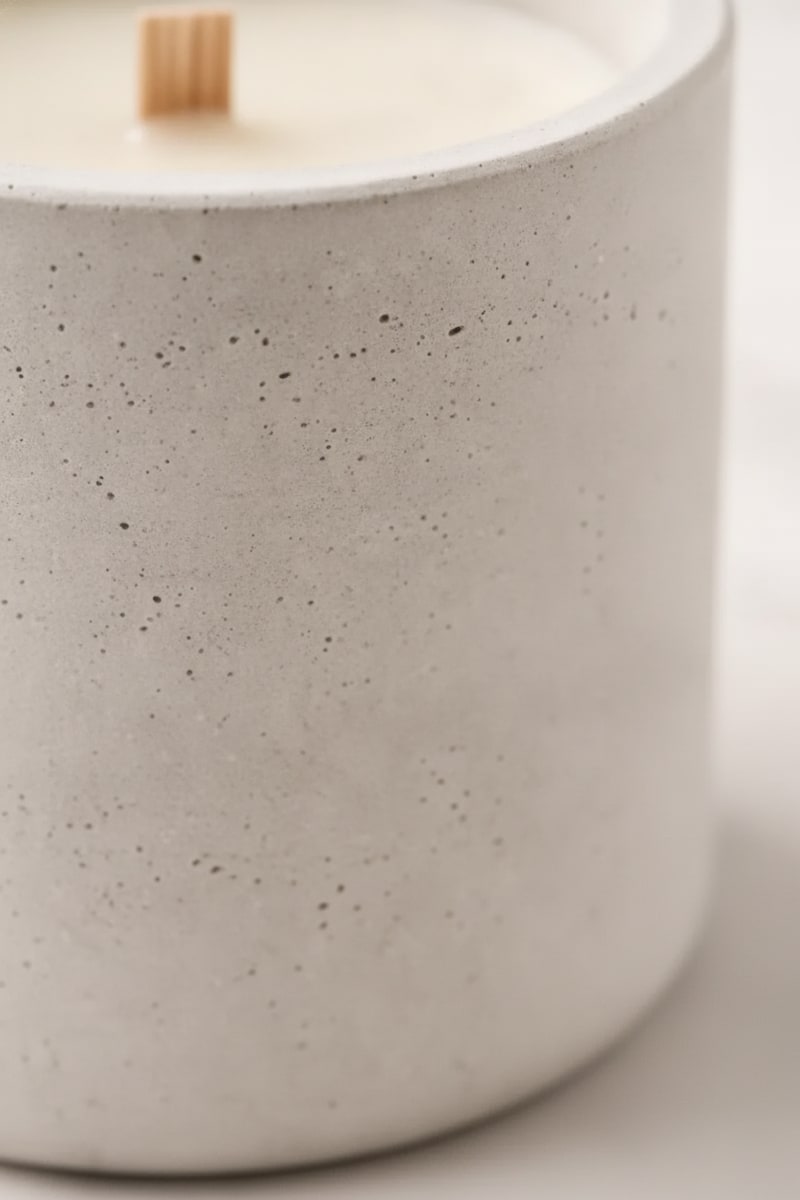 White Minimalist Concrete Soy Candle styled in a room
