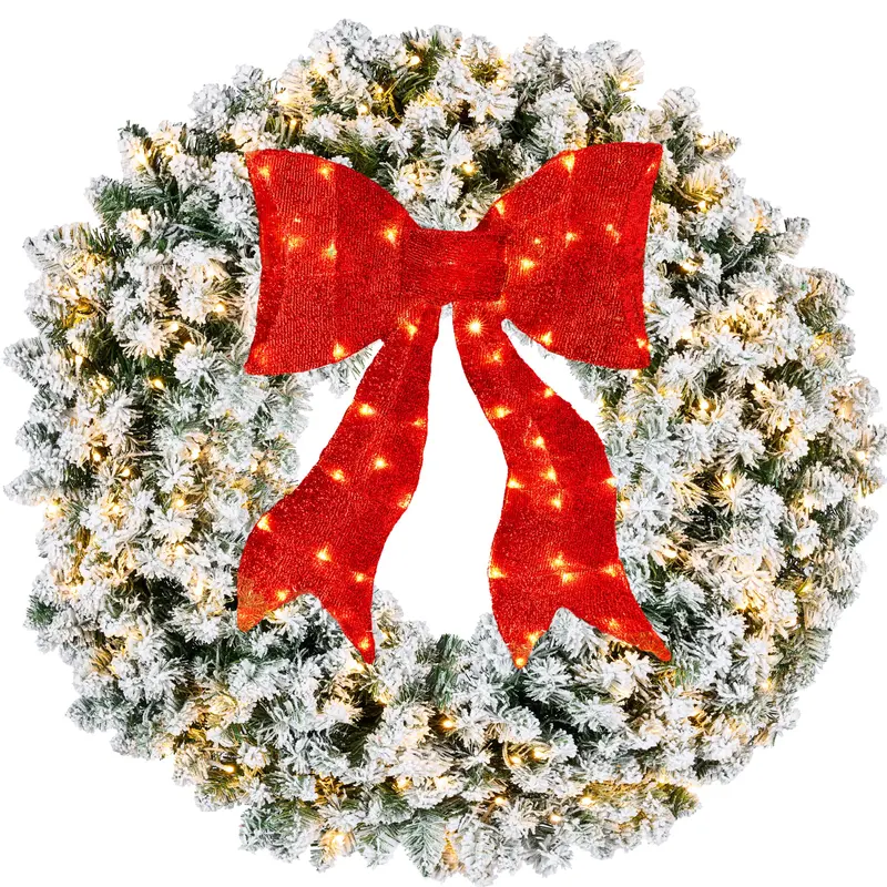 Pre-Lit Flocked Fir Wreath with Red Bow styled in a room