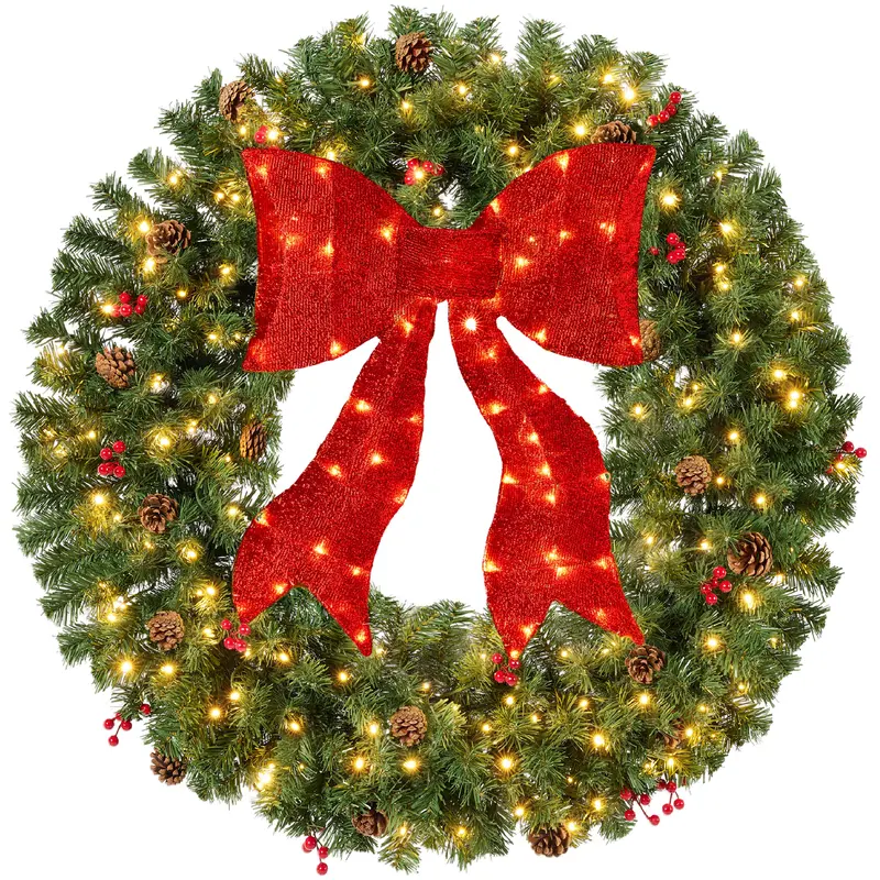 Pre-Lit Berry and Pinecone Wreath with Lit Red Bow styled in a room
