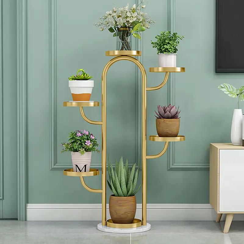 Gold Tree-Shaped Plant Stands, Set of 2 styled in a room