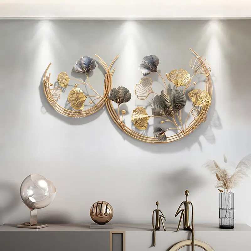 Ginkgo Leaves Round Metal Wall Art, Gold & Gray styled in a room