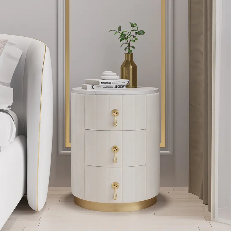 Round Velvet 3-Drawer Nightstand with Faux-Marble Top styled in a room