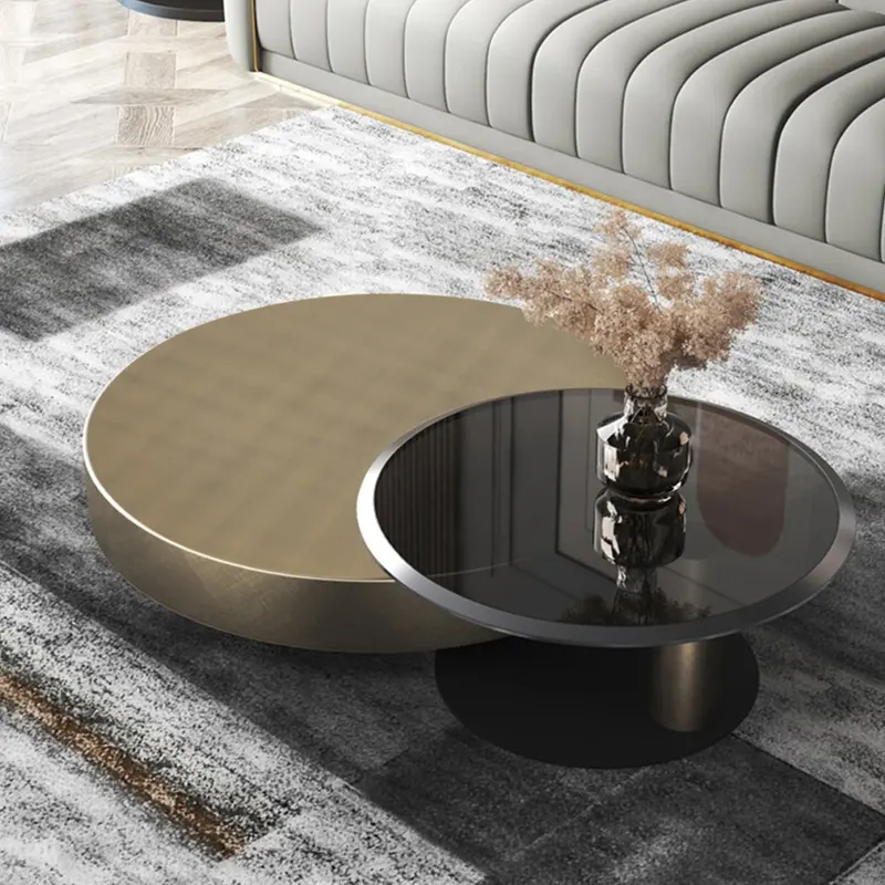 Modern Gold & Black 2-Piece Round Nesting Coffee Table Set styled in a room