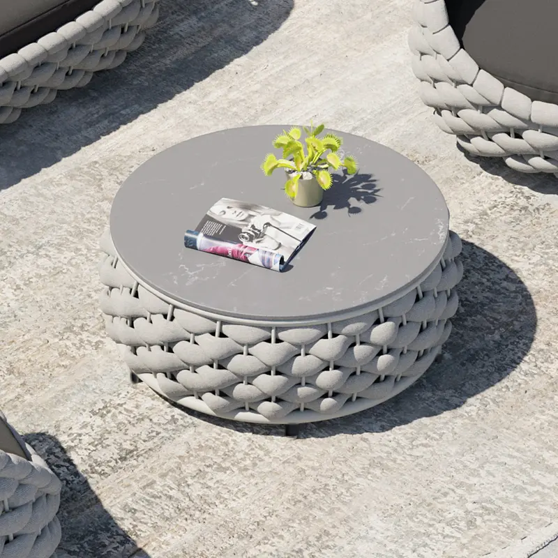 Modern Sintered Stone Round Coffee Table with Woven Base styled in a room