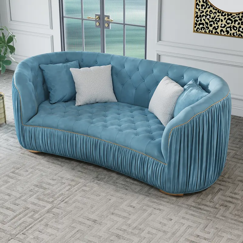 Luxury Curved Royal Blue Velvet Tufted 3-Seater Sofa (83") styled in a room