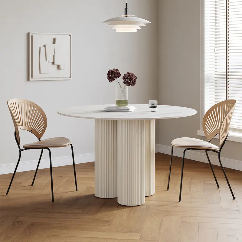 Round Faux Marble Pedestal Dining Table (39.4") styled in a room