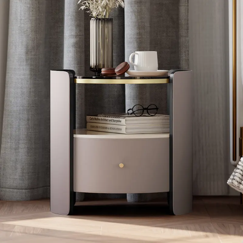 Modern Round Gray Leather Nightstand with Sintered Stone Top styled in a room