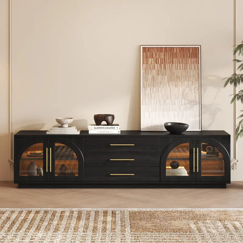 Arune 80" Black TV Stand, Arched Glass & LED styled in a room